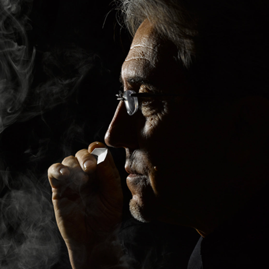 Ramon Monegal — original RichandLuxe perfumer editorial still-life on warm ivory stone